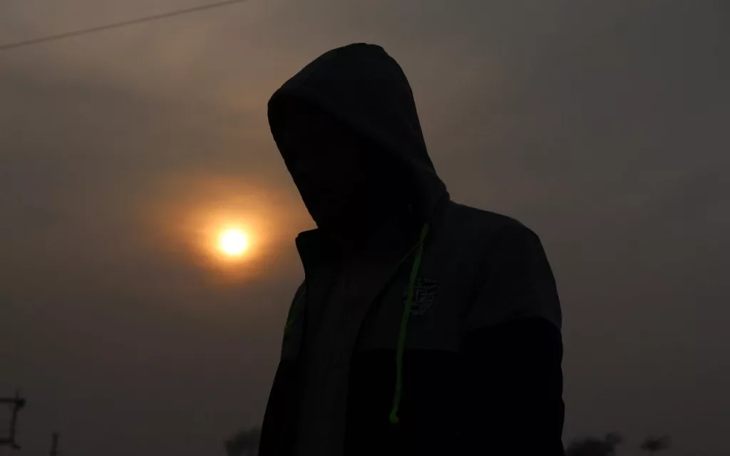 hooded man silhouette